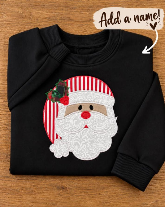 Toddler crewneck with a handmade Santa appliqué with striped hat and plaid holly